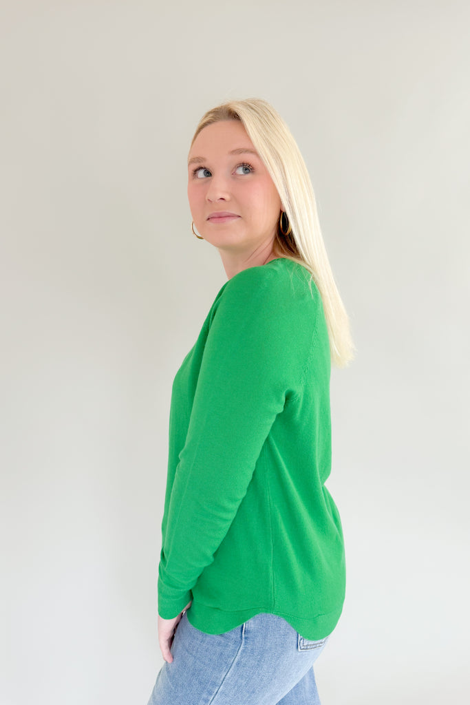 Experience the comfort and style of the Mary's Boatneck Long Sleeve Sweater! Soft, lightweight fabric and side slits for added breathability, you will be reaching for this stunner all season. This winter-ready sweater comes in a fun holiday green or red. 