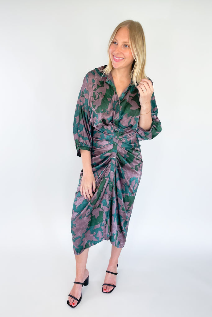 Make a statement in the Meadow Abstract Print Ruched Midi Dress! Designed with eye-catching hunter green and purple hues, plus a beautiful floral print, this midi length dress is a showstopper. It features a collared detail, 3/4 balloon sleeves, a high-low silhouette, and ruching around the waist for an unforgettable look.