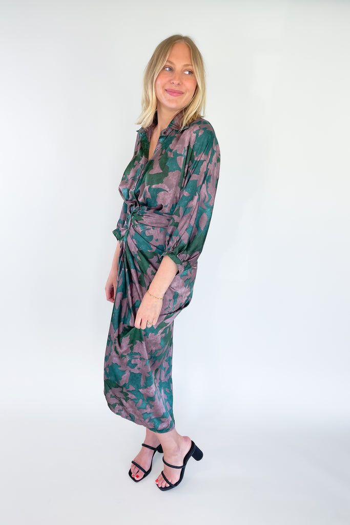 Make a statement in the Meadow Abstract Print Ruched Midi Dress! Designed with eye-catching hunter green and purple hues, plus a beautiful floral print, this midi length dress is a showstopper. It features a collared detail, 3/4 balloon sleeves, a high-low silhouette, and ruching around the waist for an unforgettable look.