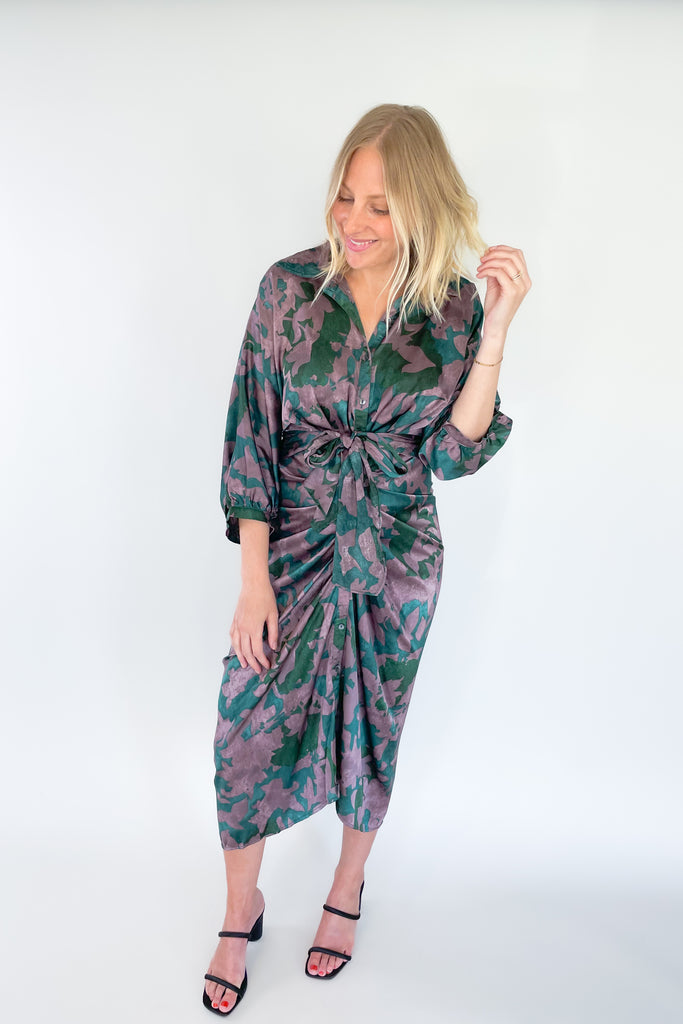 Make a statement in the Meadow Abstract Print Ruched Midi Dress! Designed with eye-catching hunter green and purple hues, plus a beautiful floral print, this midi length dress is a showstopper. It features a collared detail, 3/4 balloon sleeves, a high-low silhouette, and ruching around the waist for an unforgettable look.