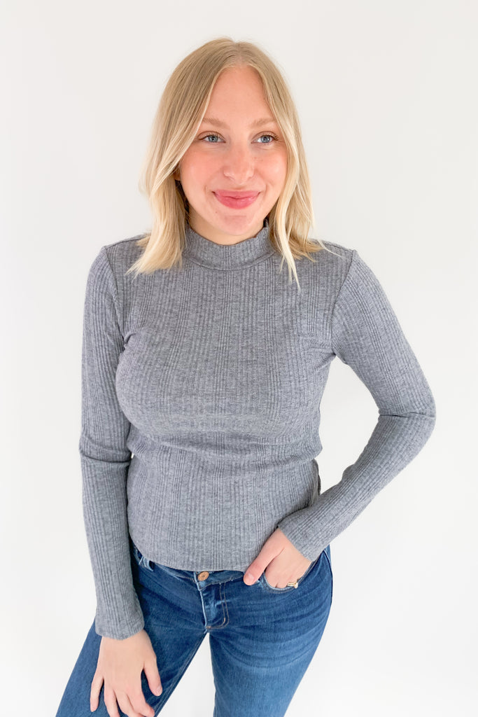 The Morgie Mock Neck Ribbed Top is a great style to have in your fall/winter wardrobe. It looks great on its own, but also would be a fantastic layering piece with its lightweight feel. The tops ribbed and stretchy too, creating a comfortable, elevated look. 