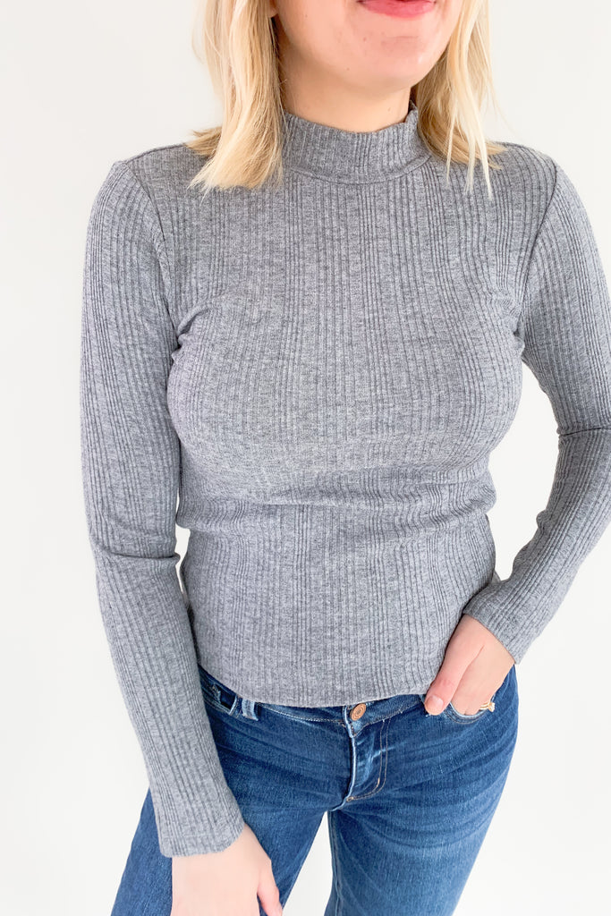 The Morgie Mock Neck Ribbed Top is a great style to have in your fall/winter wardrobe. It looks great on its own, but also would be a fantastic layering piece with its lightweight feel. The tops ribbed and stretchy too, creating a comfortable, elevated look. 