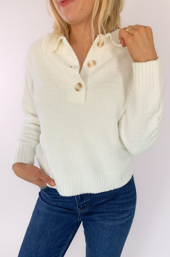 The UGG Mowery Top is a new favorite! Made with 70% recycled fibers, the UGG cozy knit is incredibly soft. Plus, the elevated texture adds a fun twist to any outfit. This half-placket top has a collar and buttons top.