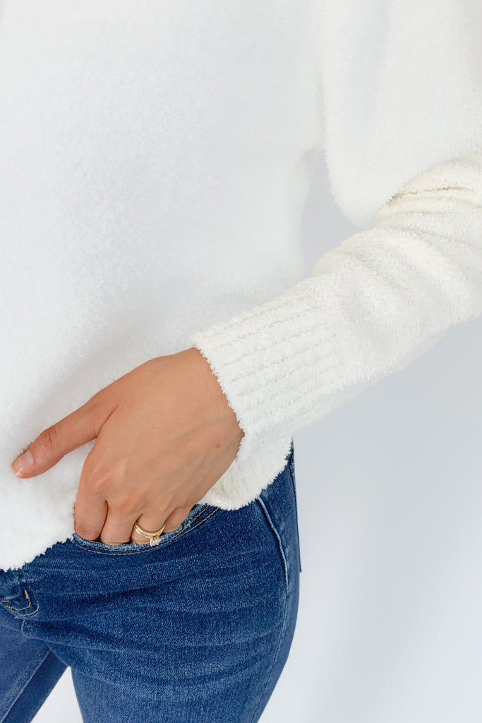 The UGG Mowery Top is a new favorite! Made with 70% recycled fibers, the UGG cozy knit is incredibly soft. Plus, the elevated texture adds a fun twist to any outfit. This half-placket top has a collar and buttons top.