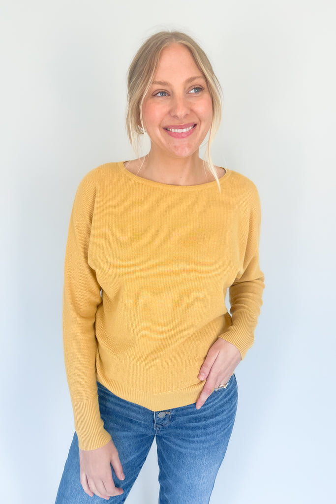 This Mustard Boat Neck Ribbed Sweater is perfect for any season! Made from an ultra soft, stretchy and lightweight fabric with a waffle texture for extra coziness, this sweater will quickly become your favorite go-to piece. 