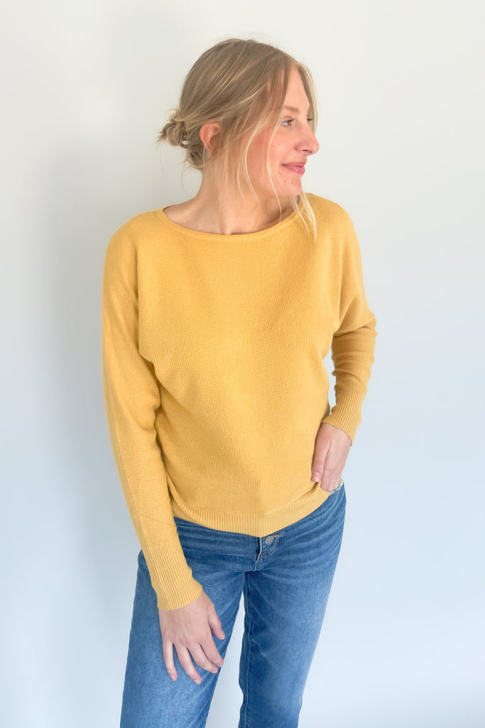 This Mustard Boat Neck Ribbed Sweater is perfect for any season! Made from an ultra soft, stretchy and lightweight fabric with a waffle texture for extra coziness, this sweater will quickly become your favorite go-to piece. 