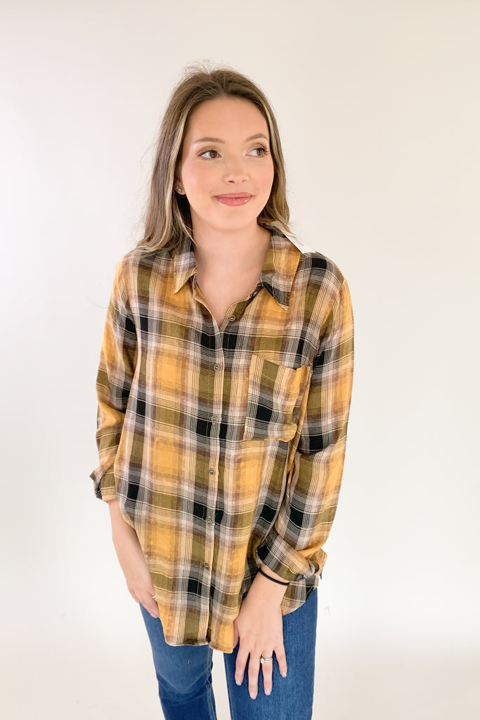 This Mustard Washed Plaid Button Down is the perfect companion for your everyday look! The ultra soft and lightweight fabric ensures that you stay comfortable all day long. You can button it up and wear it like a true shirt, or leave it unbuttoned as a casual layering piece. This style also is great if you are an Iowa Hawkeye fan! 