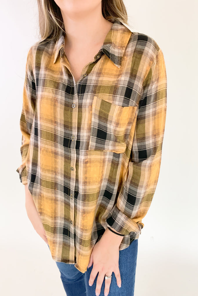 This Mustard Washed Plaid Button Down is the perfect companion for your everyday look! The ultra soft and lightweight fabric ensures that you stay comfortable all day long. You can button it up and wear it like a true shirt, or leave it unbuttoned as a casual layering piece. This style also is great if you are an Iowa Hawkeye fan! 