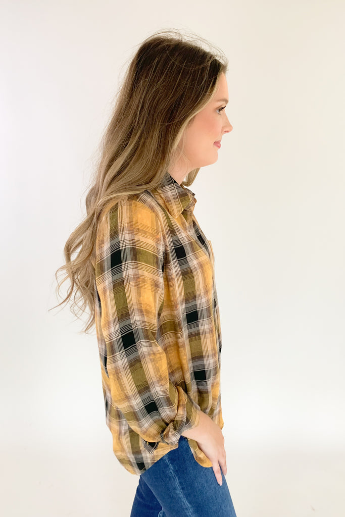 This Mustard Washed Plaid Button Down is the perfect companion for your everyday look! The ultra soft and lightweight fabric ensures that you stay comfortable all day long. You can button it up and wear it like a true shirt, or leave it unbuttoned as a casual layering piece. This style also is great if you are an Iowa Hawkeye fan! 