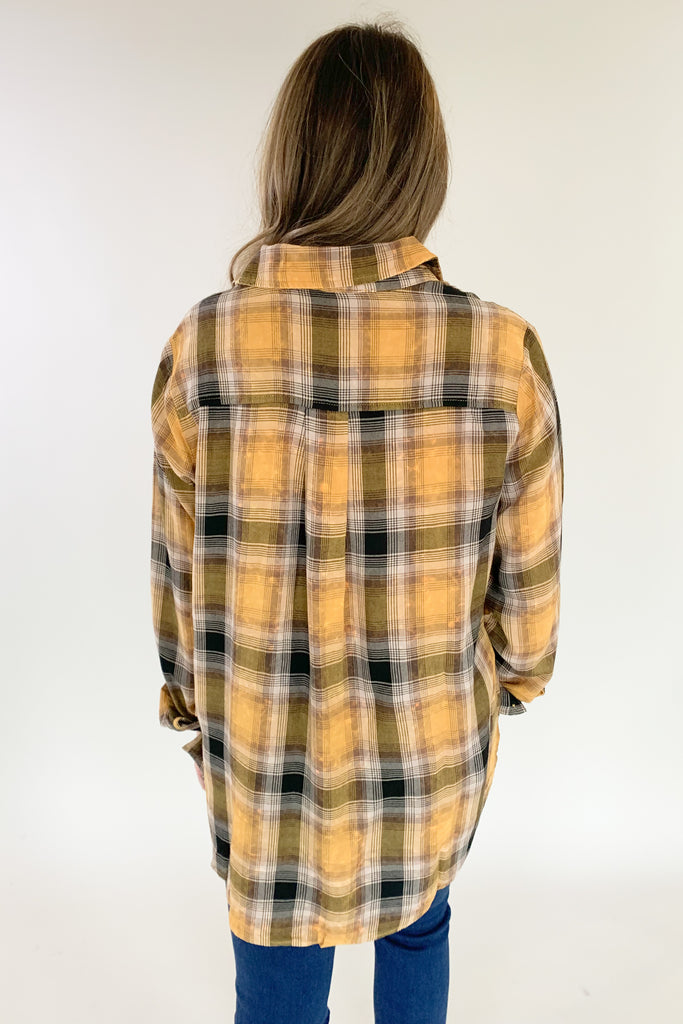 This Mustard Washed Plaid Button Down is the perfect companion for your everyday look! The ultra soft and lightweight fabric ensures that you stay comfortable all day long. You can button it up and wear it like a true shirt, or leave it unbuttoned as a casual layering piece. This style also is great if you are an Iowa Hawkeye fan! 