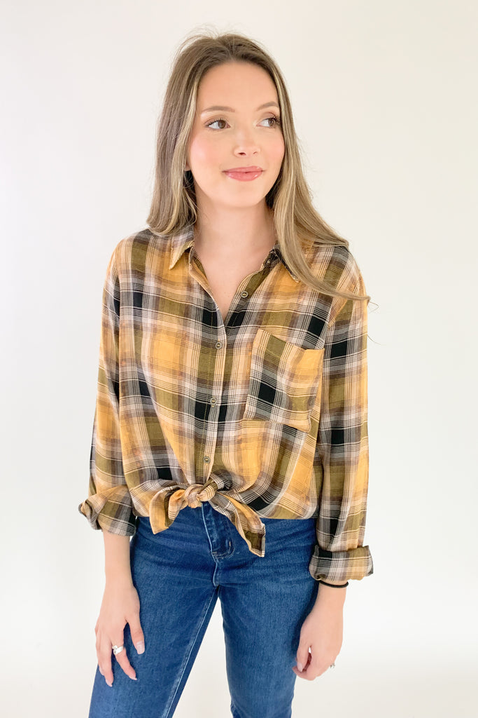 This Mustard Washed Plaid Button Down is the perfect companion for your everyday look! The ultra soft and lightweight fabric ensures that you stay comfortable all day long. You can button it up and wear it like a true shirt, or leave it unbuttoned as a casual layering piece. This style also is great if you are an Iowa Hawkeye fan! 
