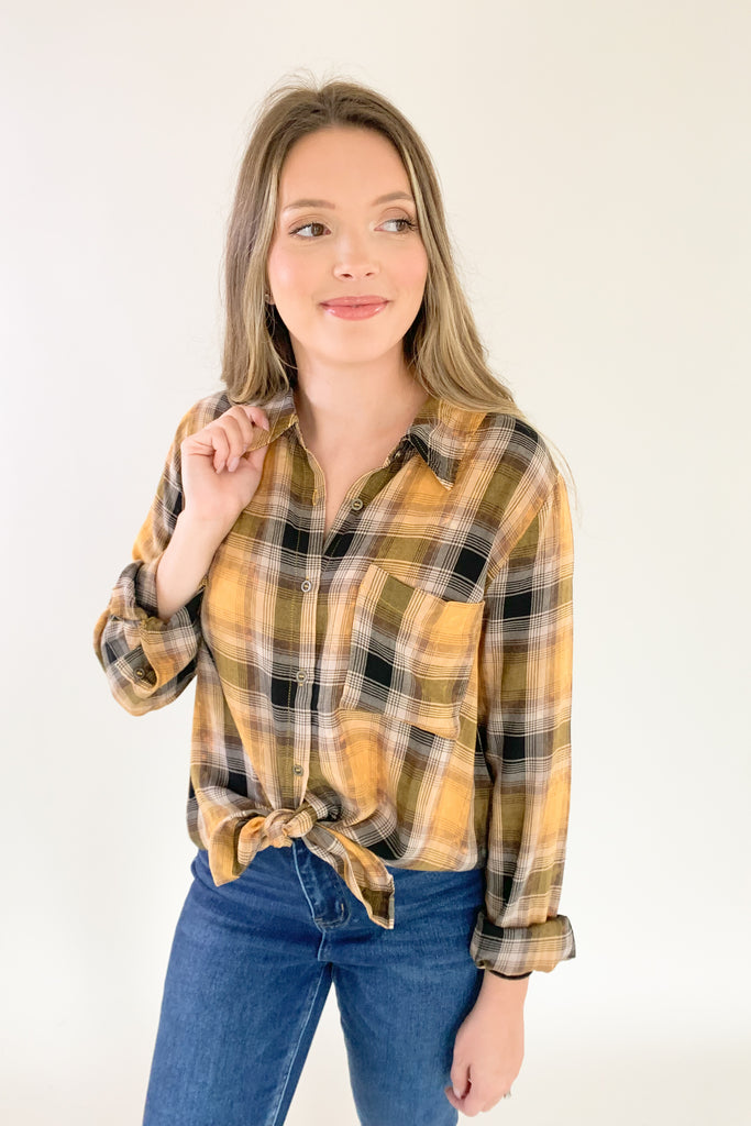 This Mustard Washed Plaid Button Down is the perfect companion for your everyday look! The ultra soft and lightweight fabric ensures that you stay comfortable all day long. You can button it up and wear it like a true shirt, or leave it unbuttoned as a casual layering piece. This style also is great if you are an Iowa Hawkeye fan! 