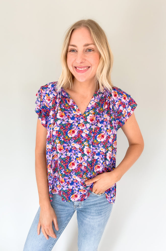 The Natalia Floral Print Ruffle Short Sleeve Blouse is perfect for any occasion with its bright floral design and gorgeous details! Combined with a v-neck tie detail and tiered ruffle sleeves, this blouse will make you stand out. It is light, airy, and perfect for the summer. Choose between two colors to complete your look! 