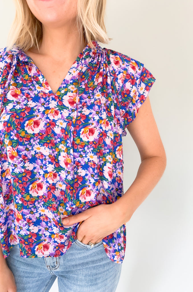The Natalia Floral Print Ruffle Short Sleeve Blouse is perfect for any occasion with its bright floral design and gorgeous details! Combined with a v-neck tie detail and tiered ruffle sleeves, this blouse will make you stand out. It is light, airy, and perfect for the summer. Choose between two colors to complete your look! 