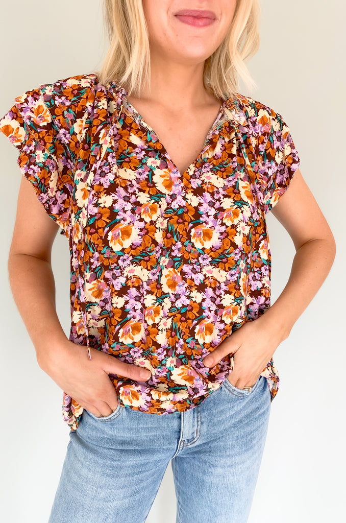 The Natalia Floral Print Ruffle Short Sleeve Blouse is perfect for any occasion with its bright floral design and gorgeous details! Combined with a v-neck tie detail and tiered ruffle sleeves, this blouse will make you stand out. It is light, airy, and perfect for the summer. Choose between two colors to complete your look! 