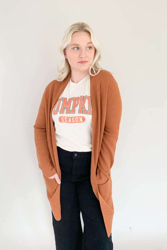 Long open front cardigan in copper brown with side pockets and soft fabric 