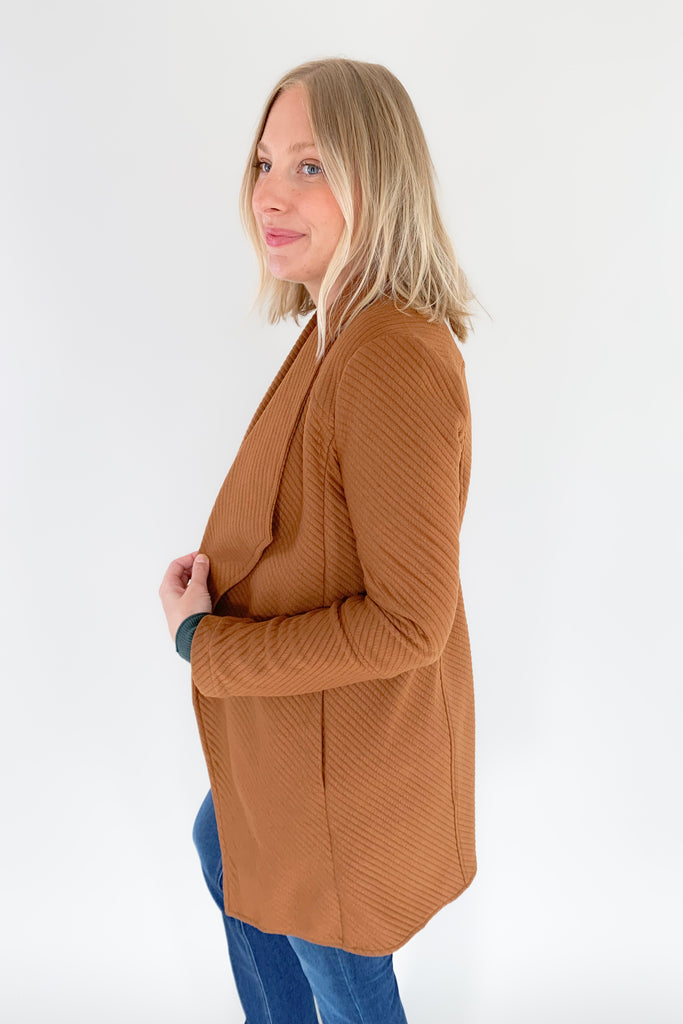 The Oaklynn Open Front Long Cardigan is elevated, chic, and timeless. You can easily dress it up or down for any event, making it such a versatile piece. The fabric is soft and stretchy too. There is a unique chevron stitching all over the cardigan for detail. We cannot say enough good things about this style- it's a must have! 