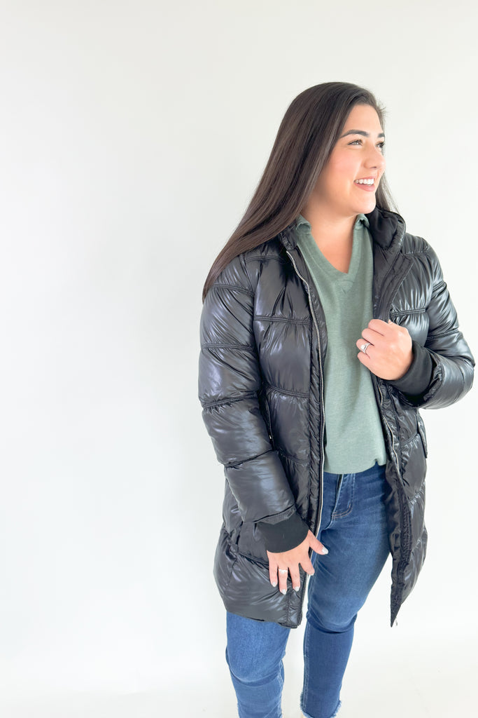 Stay stylish and warm in this Molly Bracken Puffer Jacket. Its padded black nylon shell is lined for extra insulation, and the adjustable hood and side pockets make it a practical addition to any winter wardrobe. You can dress it up or down all season! 