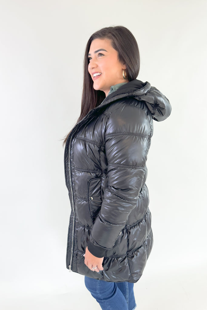 Stay stylish and warm in this Molly Bracken Puffer Jacket. Its padded black nylon shell is lined for extra insulation, and the adjustable hood and side pockets make it a practical addition to any winter wardrobe. You can dress it up or down all season! 