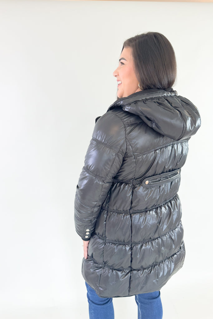 Stay stylish and warm in this Molly Bracken Puffer Jacket. Its padded black nylon shell is lined for extra insulation, and the adjustable hood and side pockets make it a practical addition to any winter wardrobe. You can dress it up or down all season! 