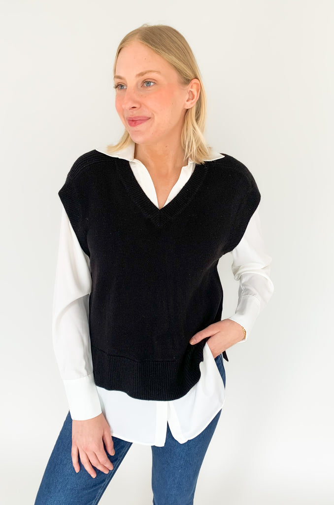 Stay stylish when the weather cools down with the Elan Geist Black Sweater Vest & Layered Blouse! This unique one-piece is made of knit fabric to keep you warm and comfortable, while featuring a flattering satin blouse underneath.