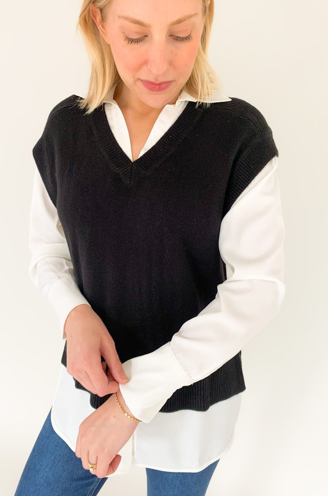 Stay stylish when the weather cools down with the Elan Geist Black Sweater Vest & Layered Blouse! This unique one-piece is made of knit fabric to keep you warm and comfortable, while featuring a flattering satin blouse underneath.