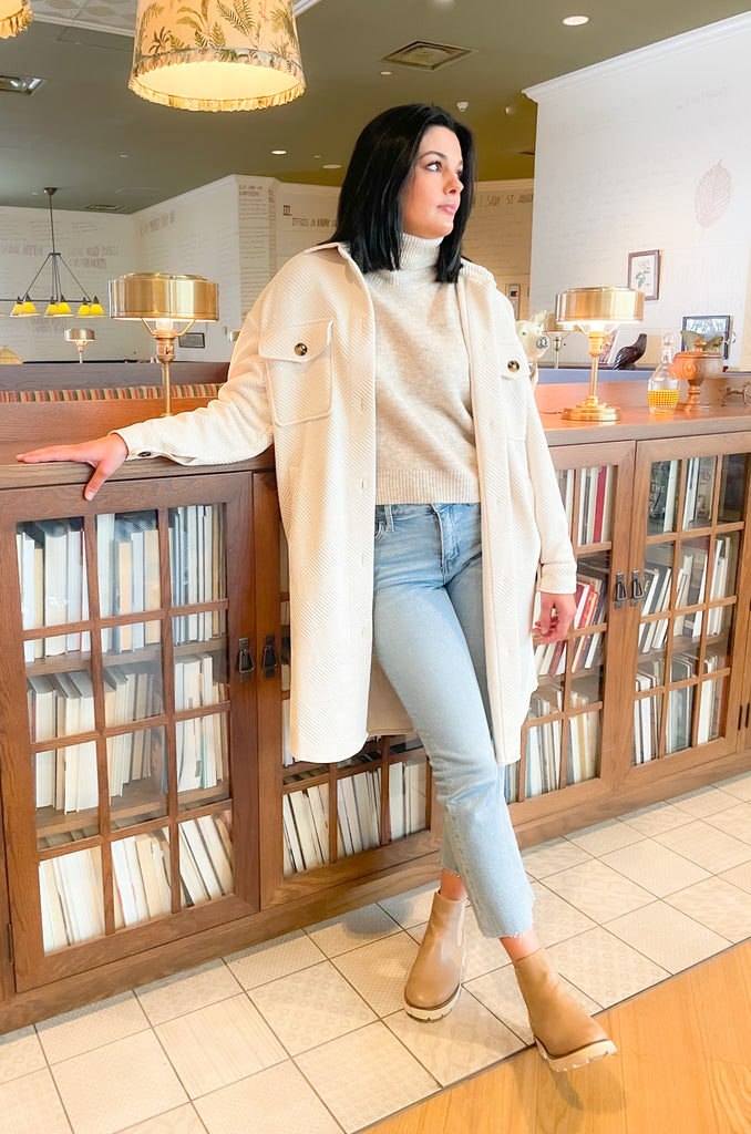 Stay warm and stylish this season with our Molly Bracken Turtleneck Drop Shoulder Sweater! Crafted with a textured, super soft fabric, this sweater features a classic, flattering fit, perfect for any wardrobe. Keep cozy and chic all season long.