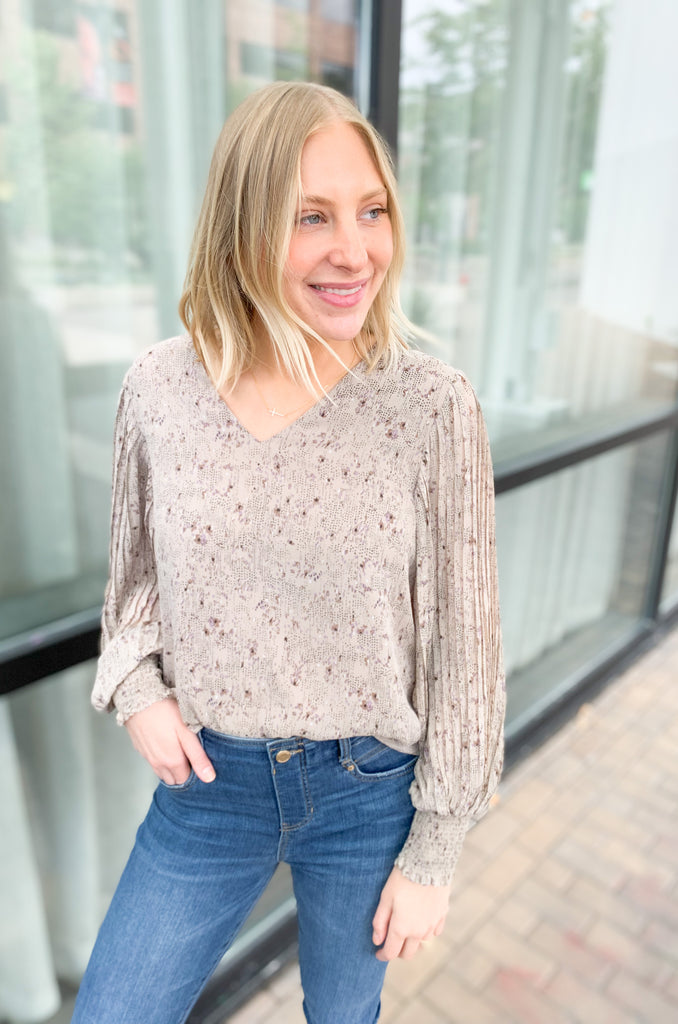 Our Fall For It Printed Long Sleeve Blouse is the perfect choice for an effortless look! This long sleeve top features crinkle sleeves with a cinched wrist for a flattering silhouette, a v neckline, and a flowy body for comfortable wear. Stay chic and comfortable with this versatile piece!