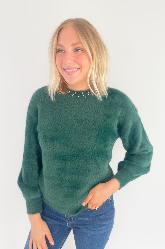 Our new Molly Bracken Pullover features a row of elegant pearls and comes in two classic colors! If you feel the fabric, you will instantly fall in love with the softness. This sweater has an ultra cozy eyelash fabrication, making if so cozy for the holiday season. You could totally dress it up to wear to holiday parties, works, and all the special days in between. 