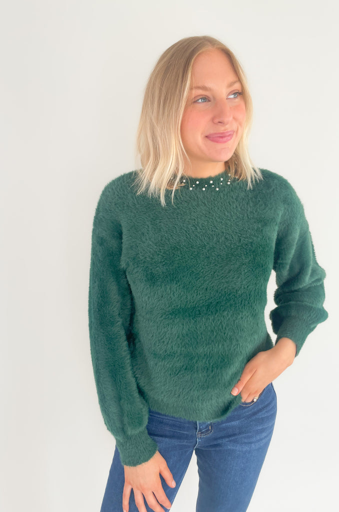 Our new Molly Bracken Pullover features a row of elegant pearls and comes in two classic colors! If you feel the fabric, you will instantly fall in love with the softness. This sweater has an ultra cozy eyelash fabrication, making if so cozy for the holiday season. You could totally dress it up to wear to holiday parties, works, and all the special days in between. 