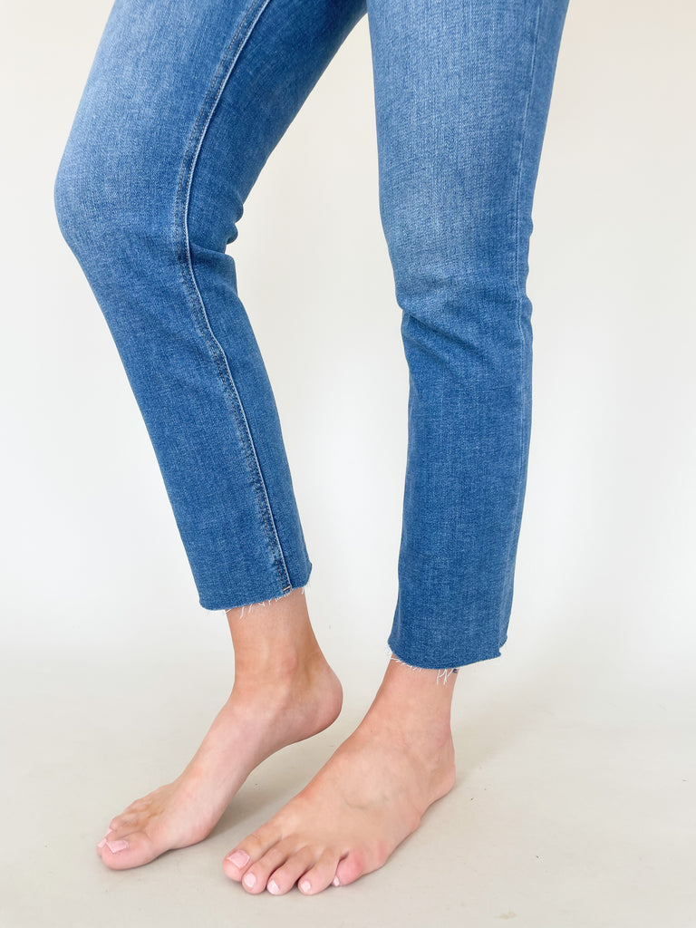 These All the Time High Rise Slim Straight Raw Hem Jeans combine style and comfort, featuring a medium-wash finish with a high rise and plenty of stretch for ease of movement. A straight leg and raw hem complete the look. 