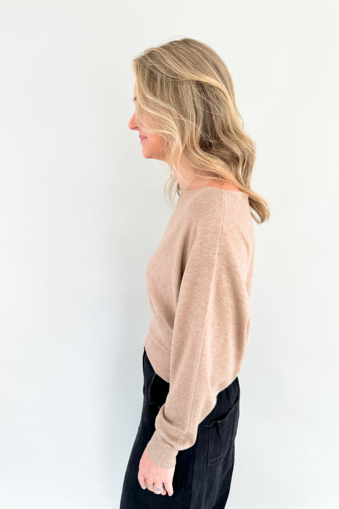 This stylish mocha sweater is perfect for any occasion, with its boat-neck design and cropped luxe fit. Enjoy the simple sophistication of this timeless look.