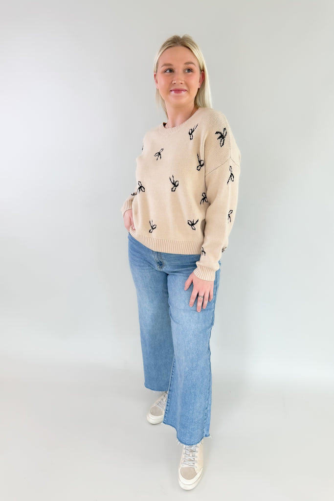 You know we love everything from Dreamers! This new Ribbon Pattern Pullover Sweater is no exception with its ultra plush and soft fabric, cute ribbon design. It feels festive, but is still subtle to be worn throughout the year. The neutral colors pair with everything too! You cannot go wrong with this one. 