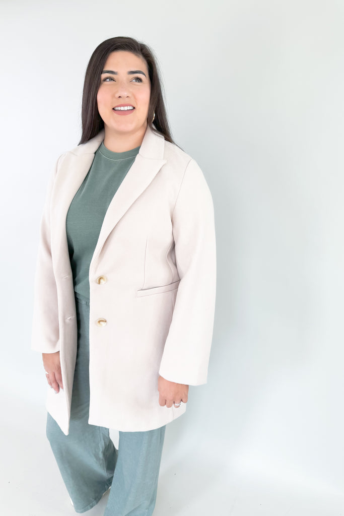 Make an elevated and cool statement with Becca's Beige Double Button Coat! This timeless, medium-weight coat is perfect for any season from fall-spring with its neutral color. It's soft and cozy, while polishing up any look! 