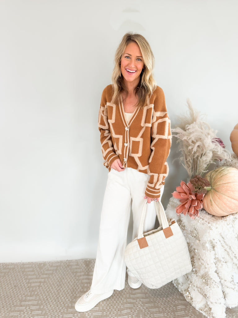 The Becky Patchwork Knit Cardigan is so cozy and fun! It mimics a trendy varsity cardigan with buttons along the front and striped hem, cuff, and neckline details. This style nothing like your average cardigan though, featuring the softest fabric and unique abstract design.