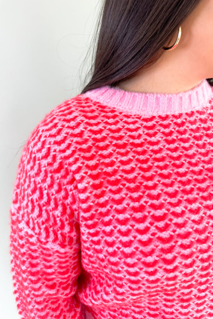 Stay warm and stylish in this eye-catching Pink & Red Cropped Sweater. Red and pink yarns are woven together, creating a distinctive design that'll brighten any look. Perfect for keeping cozy and making a statement this holiday season. Plus this style is extremely comfortable and cozy too. 