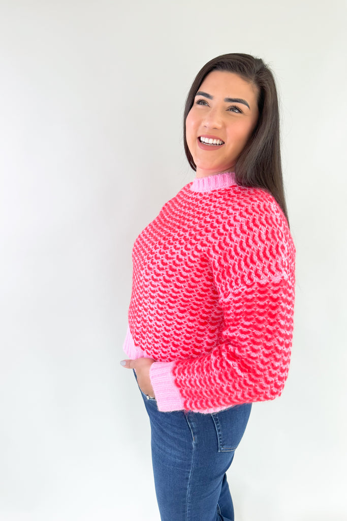 Stay warm and stylish in this eye-catching Pink & Red Cropped Sweater. Red and pink yarns are woven together, creating a distinctive design that'll brighten any look. Perfect for keeping cozy and making a statement this holiday season. Plus this style is extremely comfortable and cozy too. 