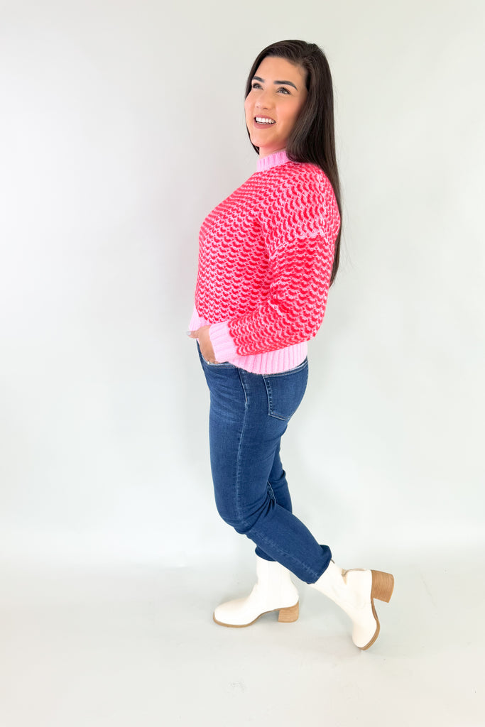Stay warm and stylish in this eye-catching Pink & Red Cropped Sweater. Red and pink yarns are woven together, creating a distinctive design that'll brighten any look. Perfect for keeping cozy and making a statement this holiday season. Plus this style is extremely comfortable and cozy too. 