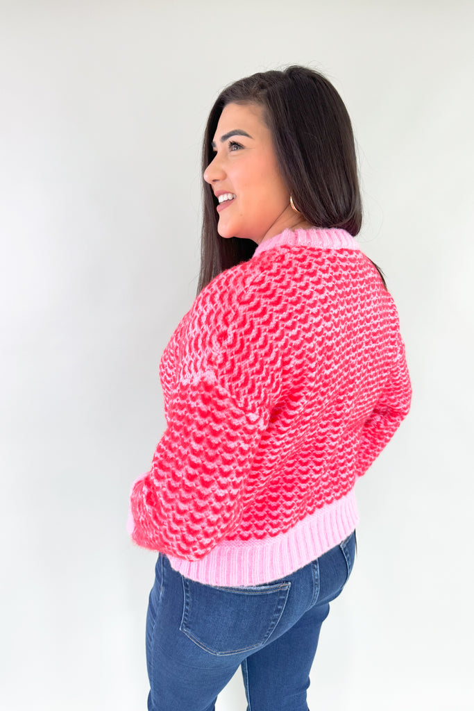 Stay warm and stylish in this eye-catching Pink & Red Cropped Sweater. Red and pink yarns are woven together, creating a distinctive design that'll brighten any look. Perfect for keeping cozy and making a statement this holiday season. Plus this style is extremely comfortable and cozy too. 