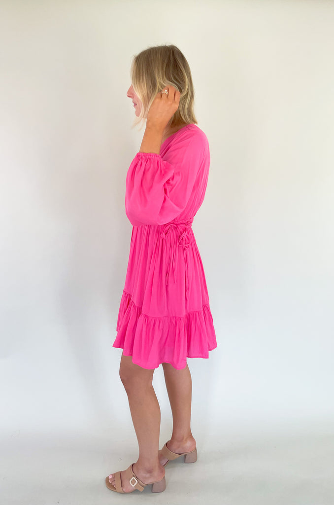 This Pinky Elastic Waistband V Neck Dress is perfect for a dinner date or special event. The baby doll shaped v neck provides a flirty and unique look while the tiered bottom adds a fun flounce. We are loving the elastic waist. It provide comfort and confidence with a great silhouette. 