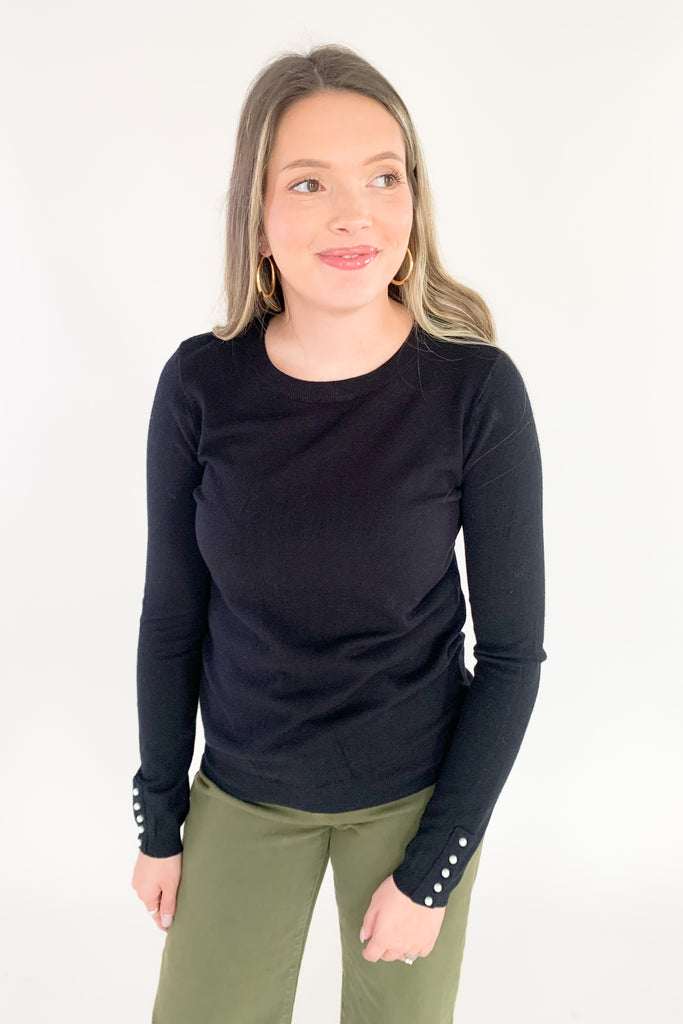 This cozy Pullover Sweater with Pearls from Molly Bracken is perfect for the holidays. Semi-fitted and complete with pearl buttons and cuffs, it's stylish and fun yet extremely comfortable. Add a touch of glam to your wardrobe with this classic piece!
