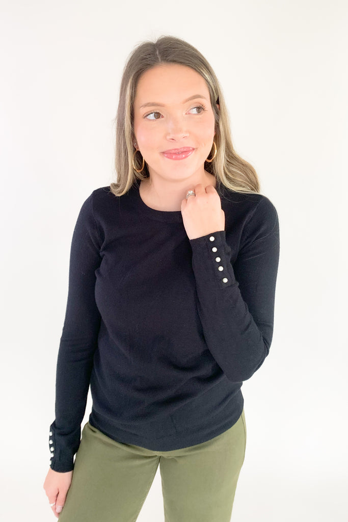 This cozy Pullover Sweater with Pearls from Molly Bracken is perfect for the holidays. Semi-fitted and complete with pearl buttons and cuffs, it's stylish and fun yet extremely comfortable. Add a touch of glam to your wardrobe with this classic piece!