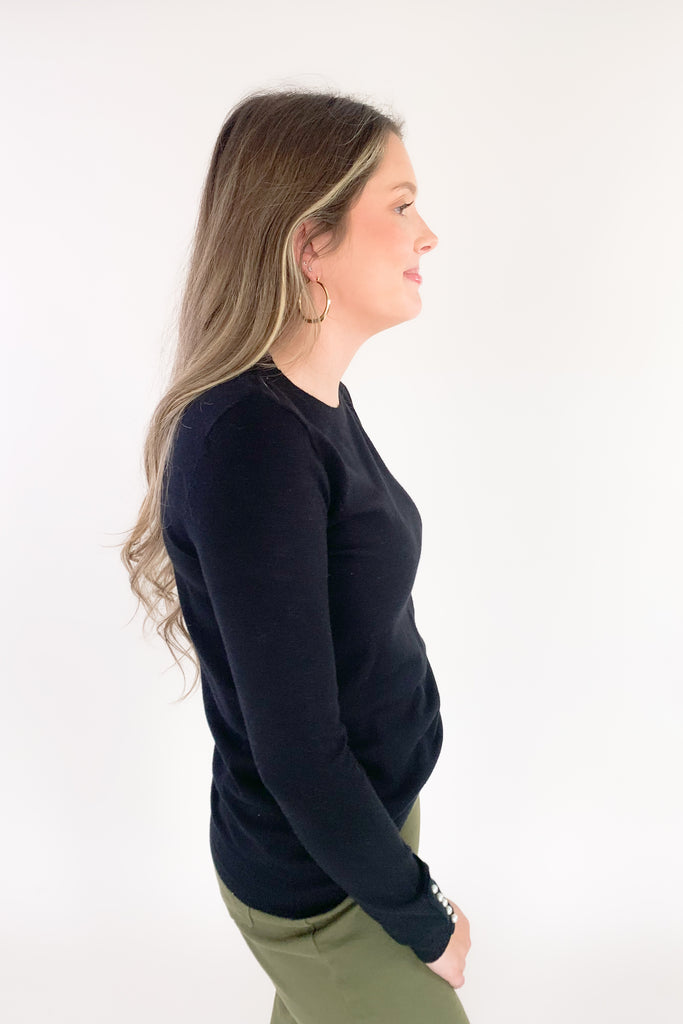 This cozy Pullover Sweater with Pearls from Molly Bracken is perfect for the holidays. Semi-fitted and complete with pearl buttons and cuffs, it's stylish and fun yet extremely comfortable. Add a touch of glam to your wardrobe with this classic piece!