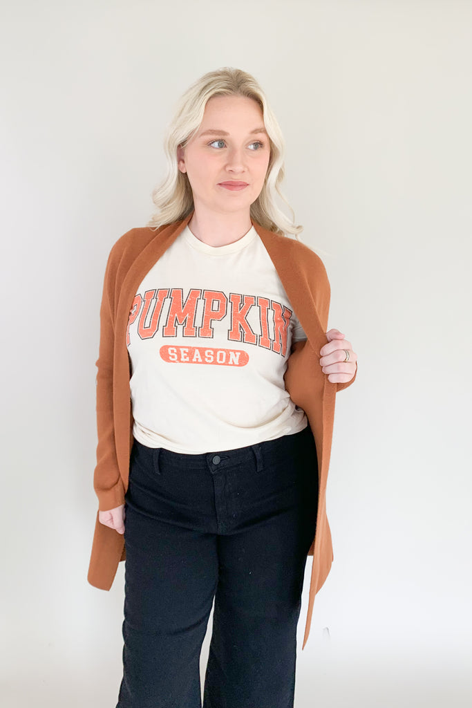 It's pumpkin season so we're celebrating with the cutest graphics! The Pumpkin Season Graphic Tee Shirt is comfortable, casual, and totally fall approved! It has a fun university inspired design with hints of orange. Layer it under cardigans or jackets all season long!