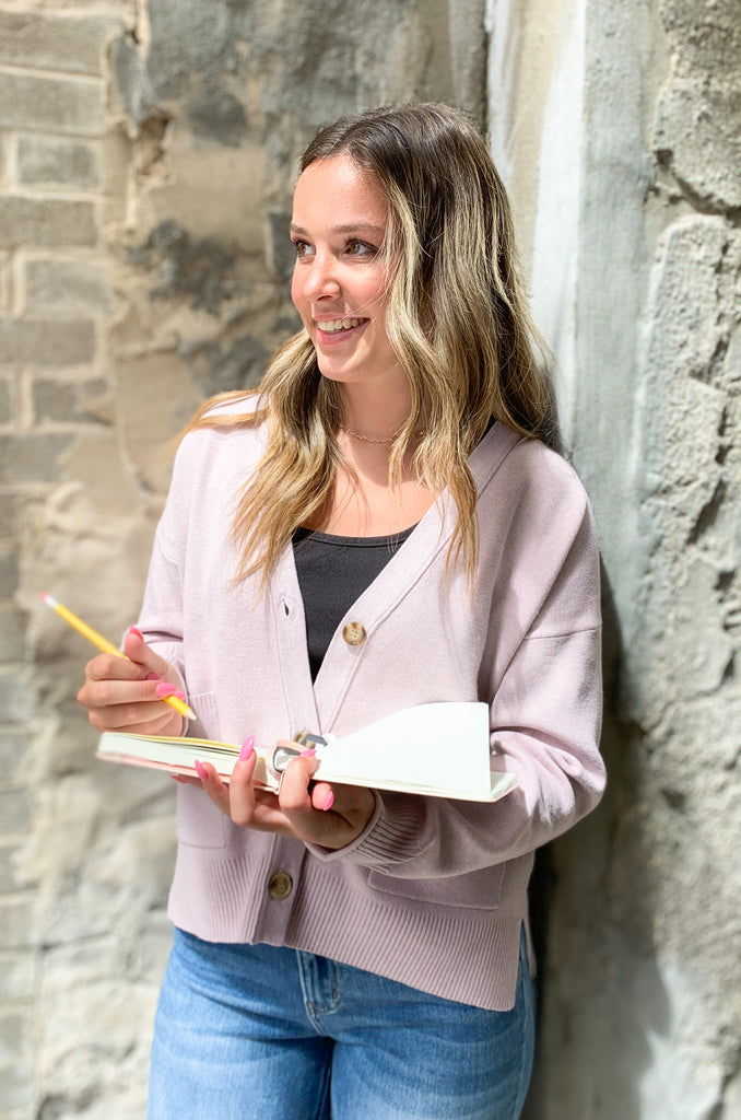 Cozy up in our new Rockwell Knit Cardigan! This classic cardigan features a beautiful knit material, three stylish tortoise buttons, and two conveniently-sized pockets for all of your essentials- choose between two colors to complete your look