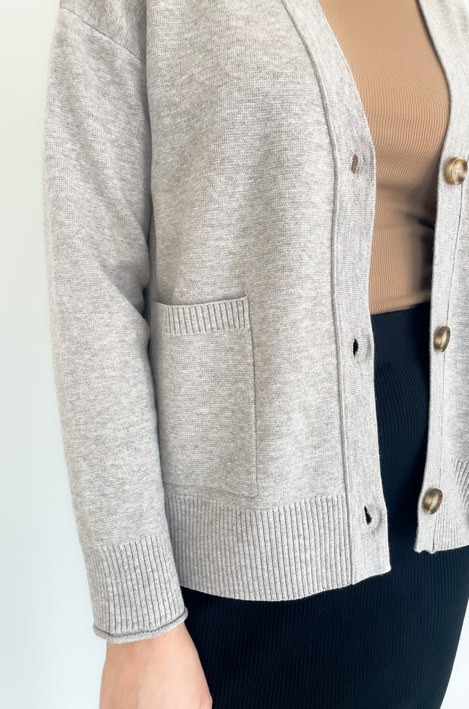 Cozy up in our new Rockwell Knit Cardigan! This classic cardigan features a beautiful knit material, three stylish tortoise buttons, and two conveniently-sized pockets for all of your essentials- choose between two colors to complete your look