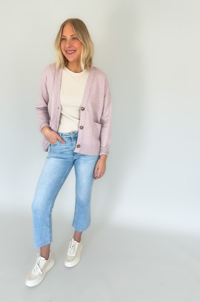 Cozy up in our new Rockwell Knit Cardigan! This classic cardigan features a beautiful knit material, three stylish tortoise buttons, and two conveniently-sized pockets for all of your essentials- choose between two colors to complete your look