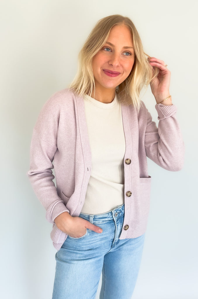Cozy up in our new Rockwell Knit Cardigan! This classic cardigan features a beautiful knit material, three stylish tortoise buttons, and two conveniently-sized pockets for all of your essentials- choose between two colors to complete your look