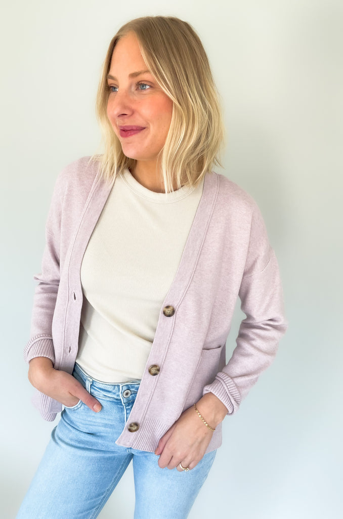 Cozy up in our new Rockwell Knit Cardigan! This classic cardigan features a beautiful knit material, three stylish tortoise buttons, and two conveniently-sized pockets for all of your essentials- choose between two colors to complete your look