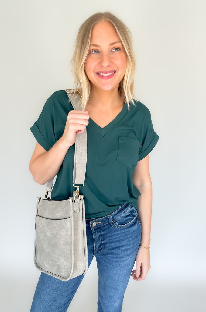 The Rosie Faux Leather Crossbody is a staple handbag! This faux leather bag has a soft a durable feel! There is a detachable, tonal, and adjustable strap that comes with the Rosie, or an Adjustable Fabric Guitar Strap is also available! Both options are so cute! This handbag is the smaller version of one of our best sellers, the Chloe Faux Leather Handbag with Guitar Strap. 